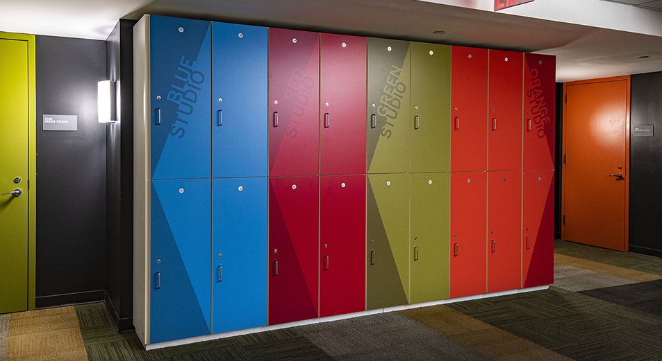 Colorful printed cut wall vinyl installed to these lockers also direct the performers to the direction of the different studios